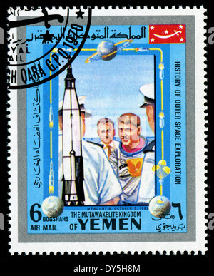 YEMEN - CIRCA 1980s: a stamp printed by Yemen shows cosmonauts MERCURY 8, OCTOBER 3, 1967), circa 1980s Stock Photo