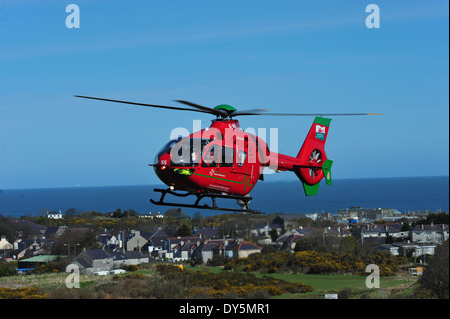 Welsh Air Ambulance Attending  Rta  Amlwch Anglesey North Wales Uk flying G-Wass welsh aircraft helicopter Stock Photo