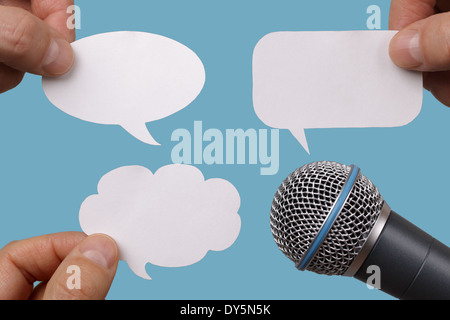 Blank speech bubbles with microphone Stock Photo