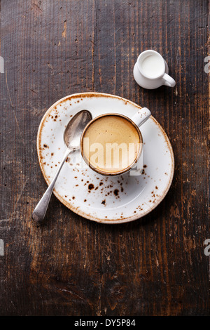 Espresso cup with milk on wooden background Stock Photo
