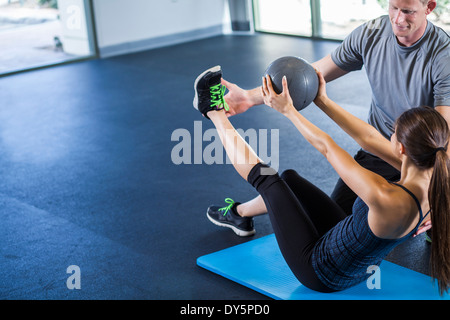 Couple working out with medicine ball Stock Photo