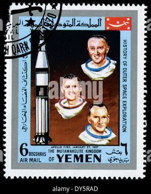 YEMEN - CIRCA 1980s: a stamp printed by Yemen shows cosmonauts (APPOLO FIRE, JANUARY, 1967), circa 1980s Stock Photo