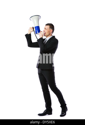 Full length portrait of businessman yelling through megaphone isolated on white background Stock Photo