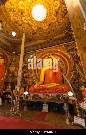 Large Buddhist statue at Gangaramaya Temple, Colombo, Sri Lanka, Asia Stock Photo