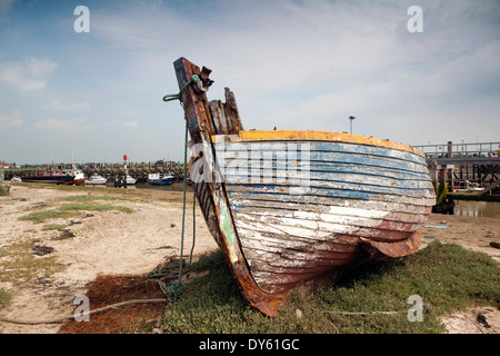 East Sussex, Rye Harbour, fishing boat high and dry above River Rother Stock Photo