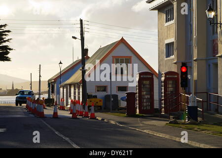 Post office, red telephone boxes, cones and traffic light, waterfront, Stanley, East Falkland, Falkland Islands, South America Stock Photo