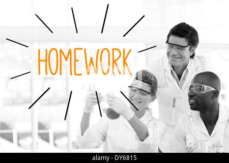 Homework against scientists working in laboratory Stock Photo