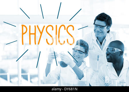 Physics against scientists working in laboratory Stock Photo