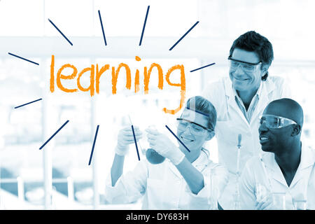 Learning against scientists working in laboratory Stock Photo