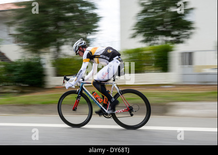 Panning shot of cyclist speeding by Stock Photo