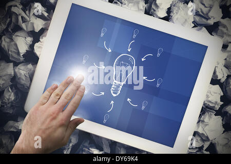 Composite image of hand touching tablet Stock Photo