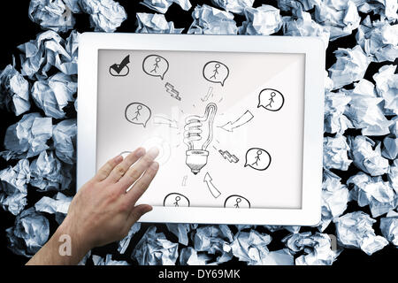 Composite image of hand touching tablet Stock Photo