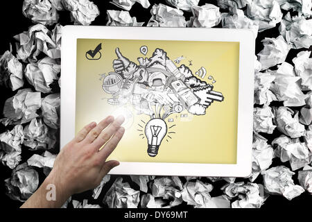 Composite image of hand touching tablet Stock Photo