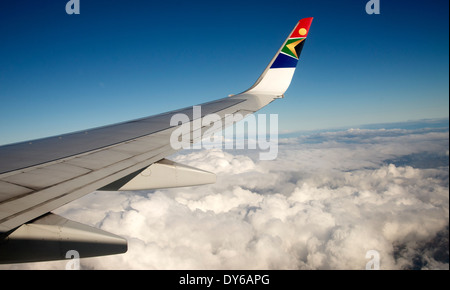 Aircraft wing above cloud over Southern Africa