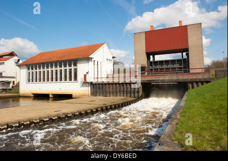 Weir and pump house with running water spill at sluice complex on april 9, 2010 in the Twente channel at Eefde, the Netherlands Stock Photo