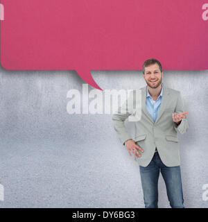 Composite image of stylish man smiling and gesturing Stock Photo