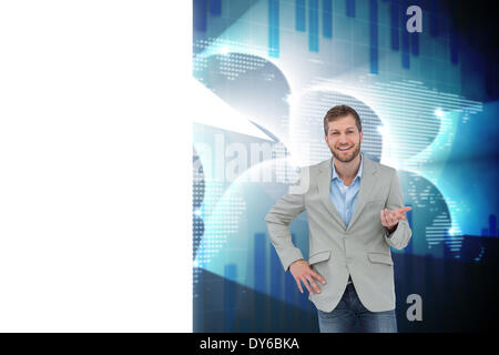 Composite image of stylish man smiling and gesturing with speech bubble Stock Photo