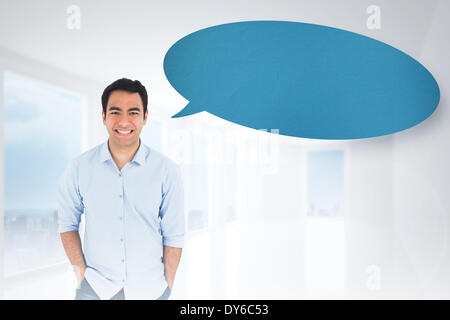 Composite image of smiling casual man standing with speech bubble Stock Photo