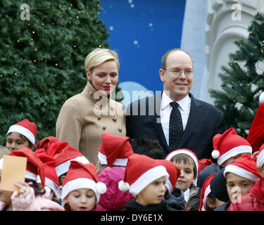 Prince Albert II of Monaco and Princess Charlene of Monaco hand out presents to Monaco children during the Christmas Celebration of St NicolasFeaturing: Prince Albert II of Monaco,Princess Charlene of Monaco Where: Monte Carlo MonacoWhen: 12 Dec 2012 Stock Photo