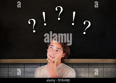 Composite image of close up of a thoughtful man Stock Photo