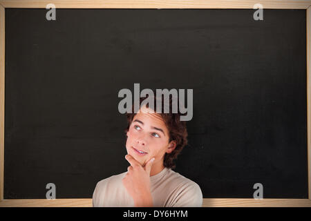 Composite image of close up of a thoughtful man Stock Photo