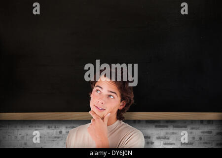 Composite image of close up of a thoughtful man Stock Photo