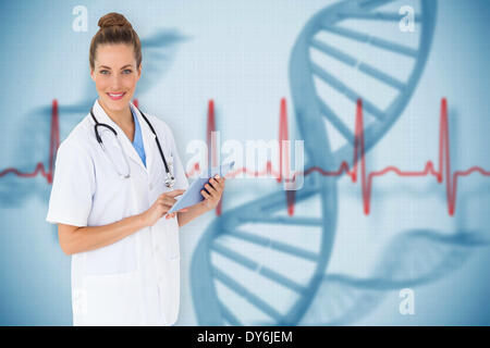 Composite image of pretty nurse using tablet pc Stock Photo