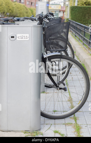 Close up of bicycle wheels, on parking Bicycles for rent Salamanca, Espana Stock Photo