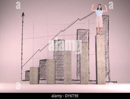 Composite image of victorious stylish businesswoman posing Stock Photo
