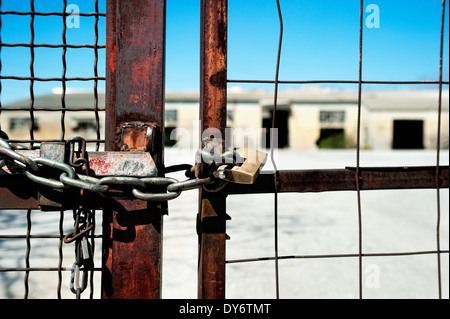Locked gate of an abandoned building Stock Photo