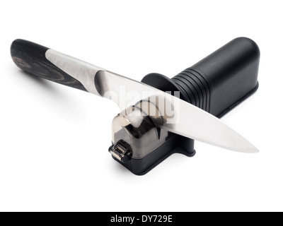 Kitchen knife on knife sharpener cut out isolated on white background Stock Photo