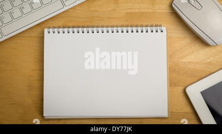 Overhead of notepad and technology Stock Photo - Alamy