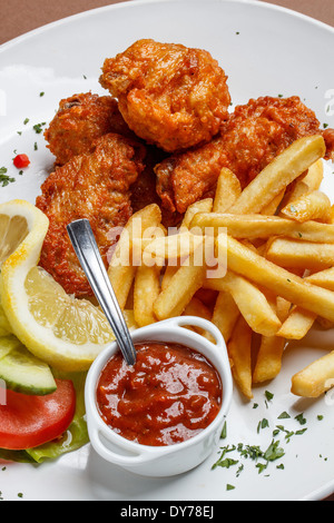 Fried chicken legs with french fries Stock Photo