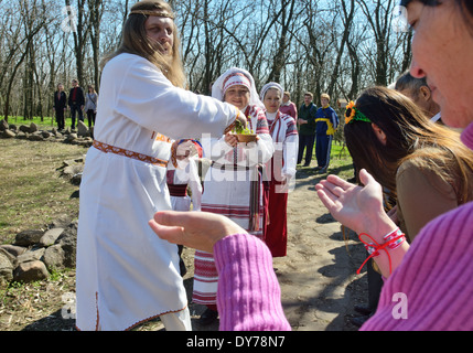 Pagan "Easter" in Ukraine. Priest and worshipers in traditional clothes