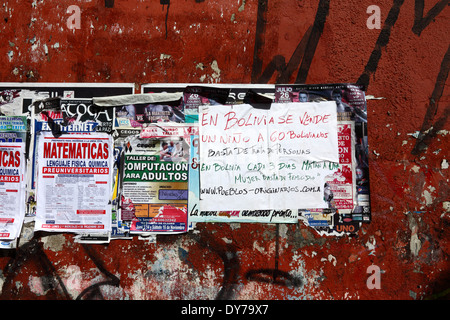 Poster protesting about / warning against child trafficking and violence against women on wall, La Paz, Bolivia Stock Photo
