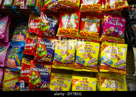 Packets of sweets candy on sale at child eye level in a supermarket ...