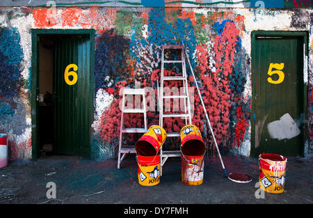 Fraserburgh, Scotland, UK 8th April, 2014. Doors No.5 & No.6 and the colourful wall at W Bruce Ship Painter’s office at the harbour in Fraserburgh.  At W Bruce Ship Painter’s office, workers have been cleaning their brushes against one wall since the company launched and now it is attracting tourists from all over the world.  The alternative tourist attraction is a unique blend of texture and colour and workers at the harbour have seen people from all walks of life come and admire the incredible façade. Stock Photo