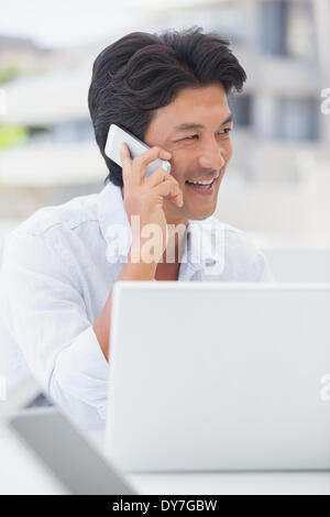 Happy man talking on phone Stock Photo