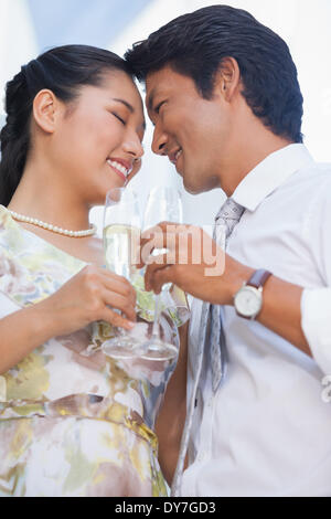Happy couple having champagne together Stock Photo