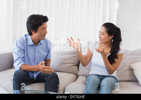 Couple having a dispute on the sofa Stock Photo