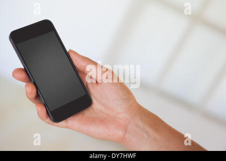 Womans hand holding black smartphone Stock Photo