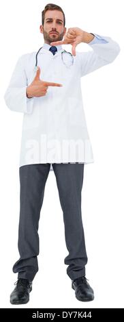 Handsome young doctor gesturing with hands Stock Photo