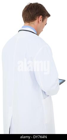 Young doctor in lab coat using tablet pc Stock Photo