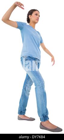 Powerless brunette in jeans and tshirt Stock Photo