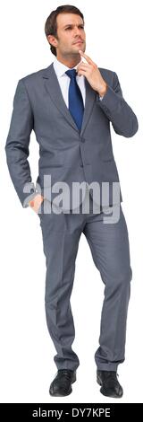 Thinking businessman touching his chin Stock Photo