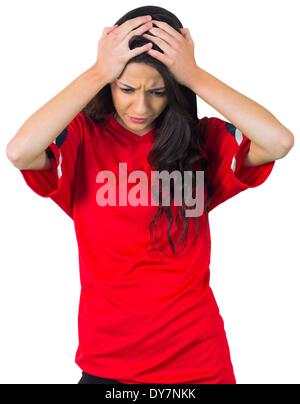 Disappointed football fan in red Stock Photo