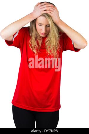 Disappointed football fan in red Stock Photo