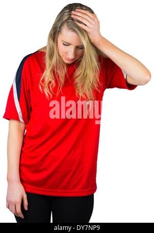 Disappointed football fan in red Stock Photo