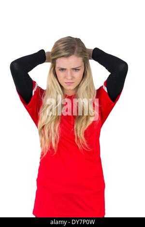 Disappointed football fan in red Stock Photo