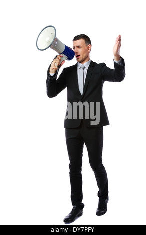 Full length portrait of businessman yelling through megaphone isolated on white background Stock Photo